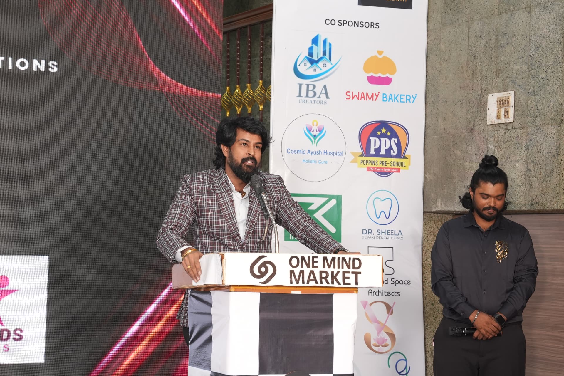 Suresh Bose speaking at the One Mind Market stage